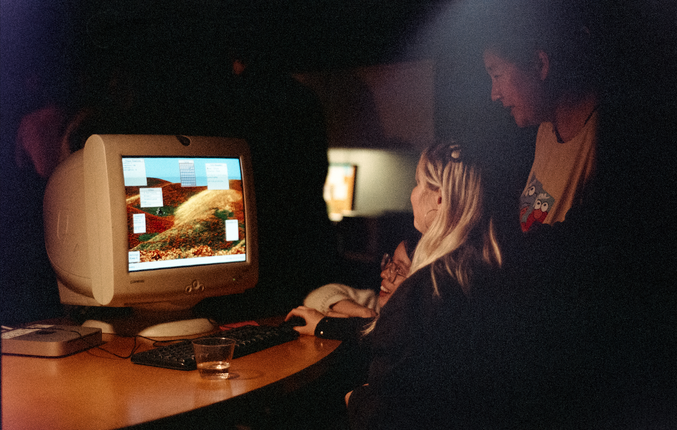 two people play the poppy grower on an old monitor