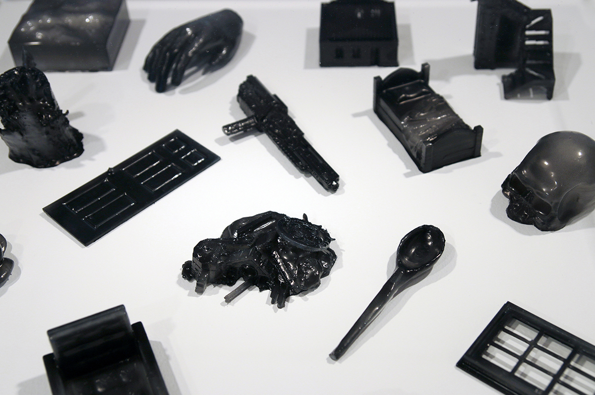 printed 3d models of objects, resin brushed with india ink